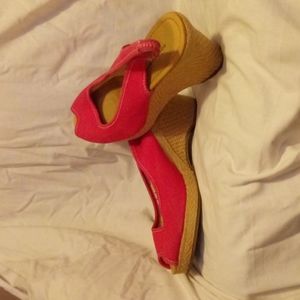 Pink and tan heeled sling backs .
